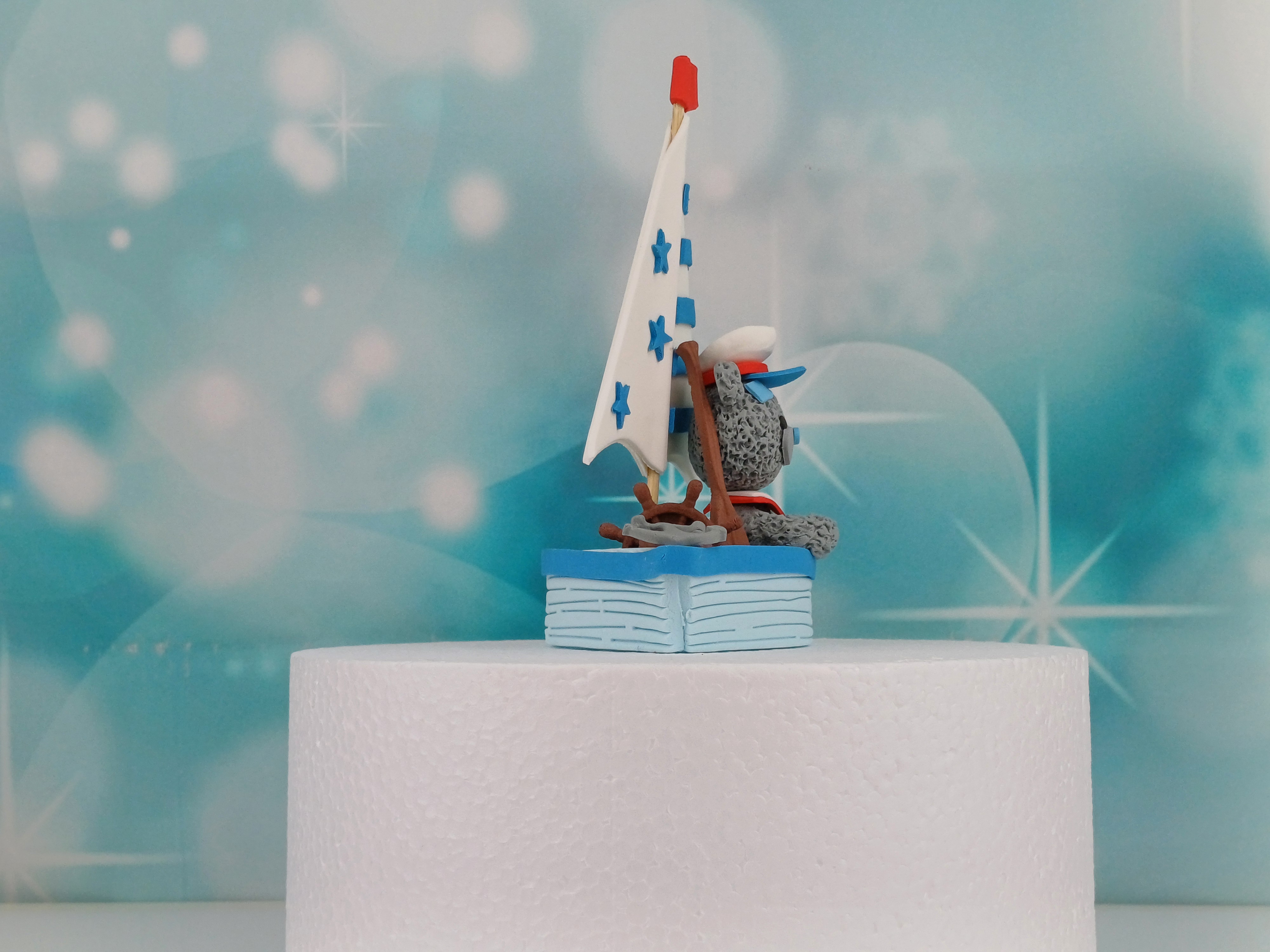 Tortenfigur Bär mit Boot