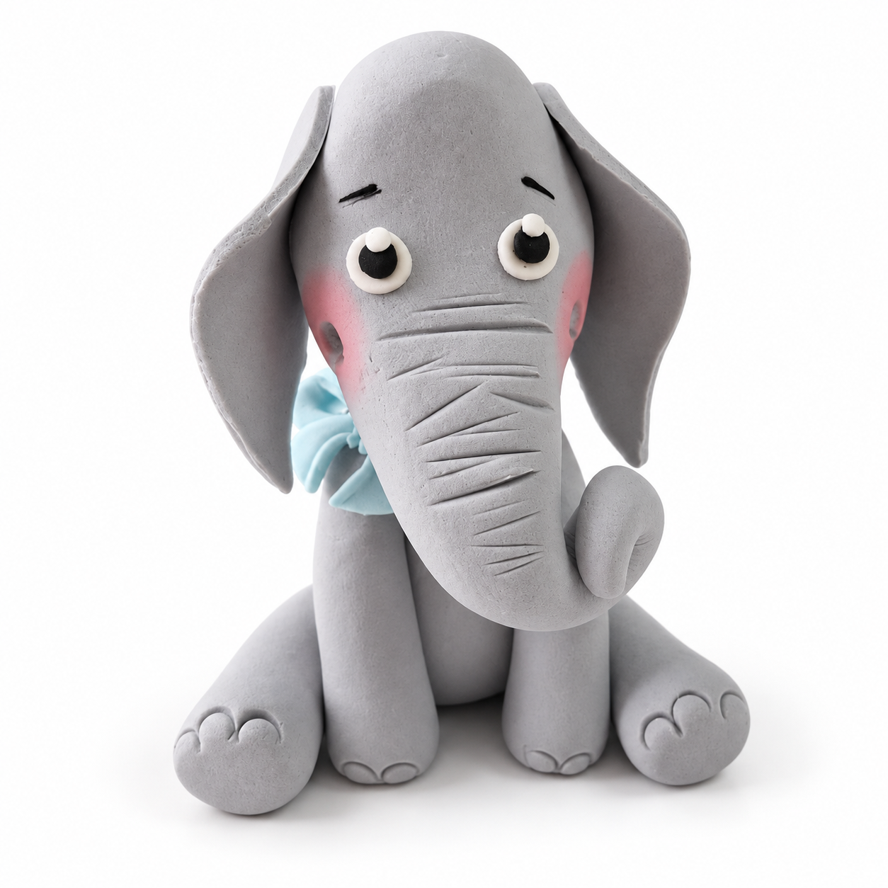 Tortenfigur Elefant mit blauer Schleife
