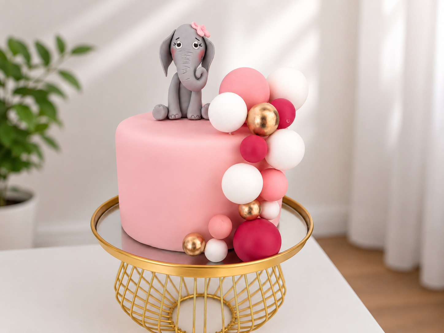 Tortenfigur Elefant mit rosa Schleife 
